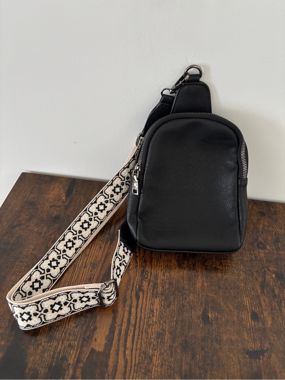 Black Leather Crossbody Sling Bag with Patterned Strap